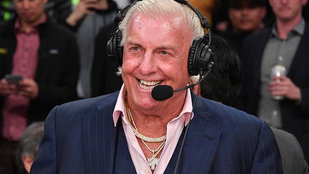 Ric Flair took to Twitter to say that he’s not the person in a viral photo that seemingly shows a man engaging in oral sex with a woman on a train.