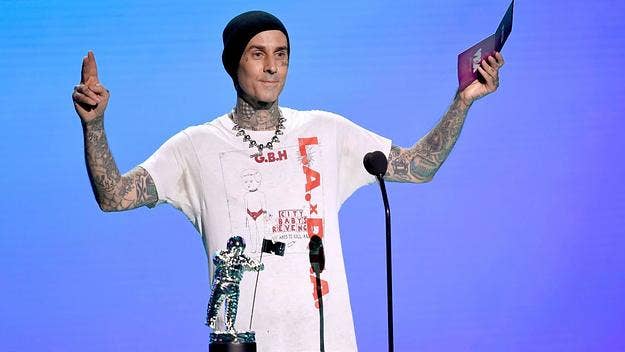 Travis Barker has just been seen boarding a plane for the first time since a crash in 2008 killed two of his friends and left him with severe burns.