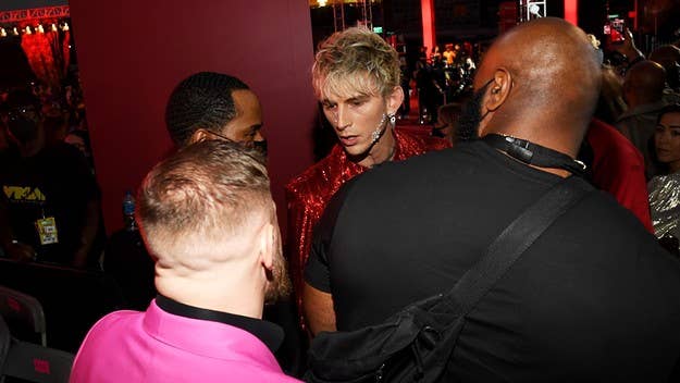 Machine Gun Kelly and Conor McGregor needed to be separated on the red carpet of the MTV Video Music Awards after the two got into a physical altercation.