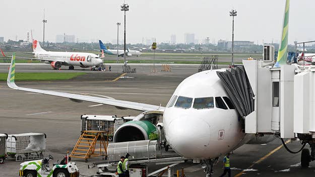 According to police, the man boarded a Citilink plane on Sunday while wearing a niqab veil and carrying a vaccination card with his wife's name on it.
