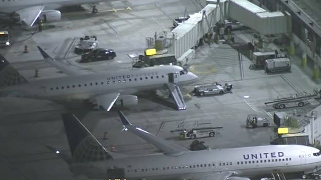 A LAX passenger jumped out of a plane’s exit door Friday as it was taxiing for takeoff, reportedly after attempting to enter the plane's cockpit moments before.