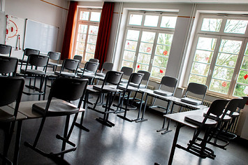Lower Saxony, Oldenburg: Chairs and desks stand in the classroom of a school.