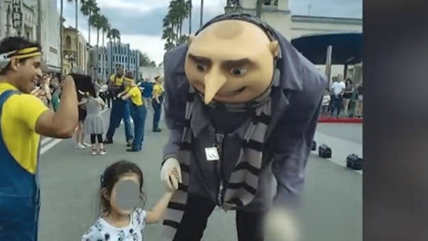 Two families are suing Universal Orlando after an actor dressed in a 'Despicable Me' Gru costume flashed a white power symbol on two separate occasions.