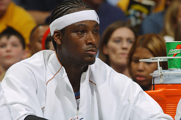 Kwame Brown #5 of the Washington Wizards watches the game