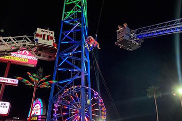 Two Florida teens were suspended on a slingshot ride