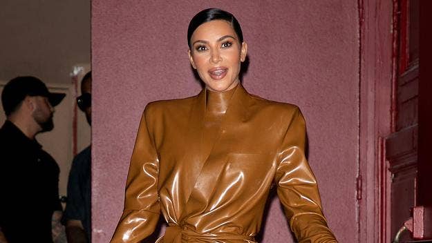 Kim Kardashian just showed off some new ice, captioning her latest Instagram post, 'new opal birthstone grill alert,' flexing the hardware in her mouth.