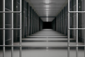 Prison interior. Jail bars open, empty corridor, cells, dark background.