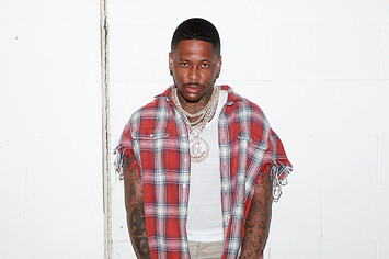 YG poses for a photo as he gives away 4Hunnid Block Runner sneakers