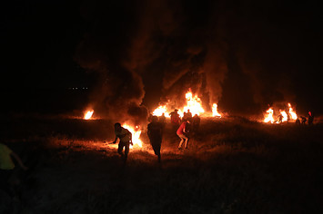 Demonstrators burn tires after the intervention of Israeli forces in Gaza City, Gaza.