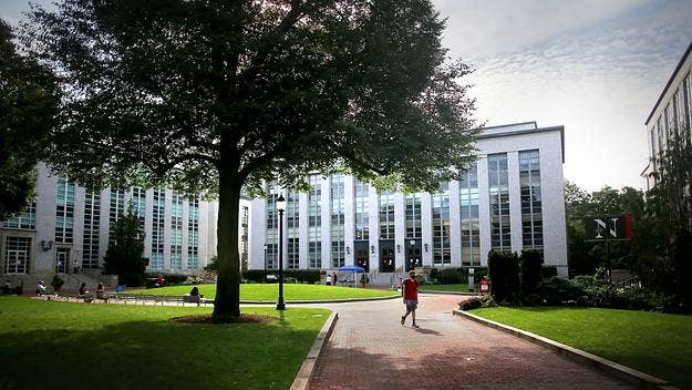 A Northeastern University track and field coach who was terminated in 2019 has been arrested and charged with stealing nude photos from six student athletes.