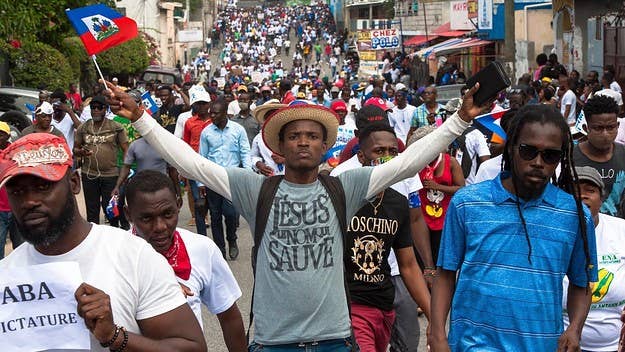 Thousands of Haitians have taken to the streets demanding its US-backed president to step down, as the country faces increasing violence and economic pain.