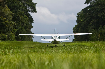 Cessna 206 on the runway of the ranger station in Corcovado National Park.