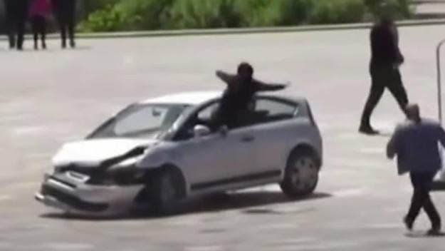 Klodian Elqeni jumped through an open window feet first to try and prevent a reckless driver from careening through a public square in Albania.