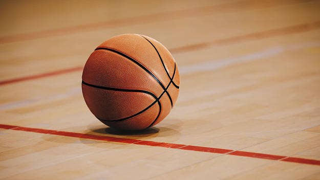 An announcer was caught on a hot mic using racial slurs towards a high school girl's basketball team who kneeled during the National Anthem.
