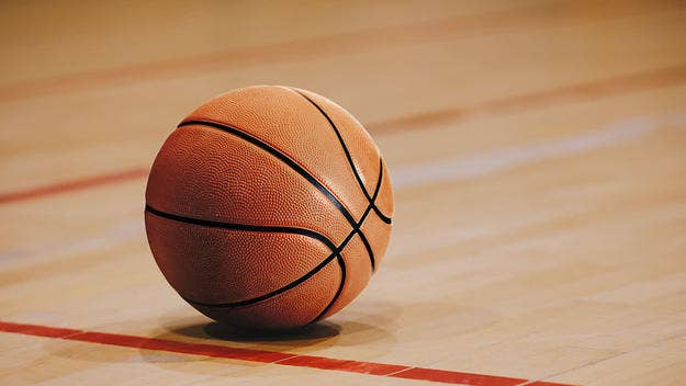An announcer was caught on a hot mic using racial slurs towards a high school girl's basketball team who kneeled during the National Anthem.
