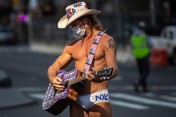 The Naked Cowboy greets tourists as Times Square is mostly empty.