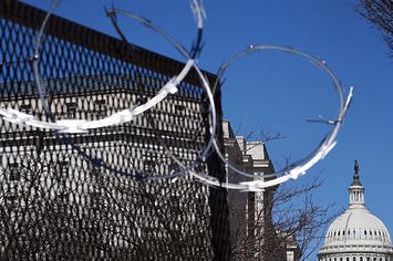 Razor wire is seen on fencing near the US Capitol Building on Capitol Hill
