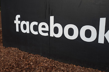 Sign with logo at the headquarters of Facebook in Silicon Valley.