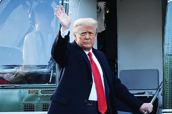 Outgoing US President Donald Trump waves