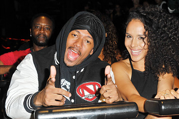 Nick Cannon and Brittany Bell ride the 'Ghostrider' Roller Coaster.