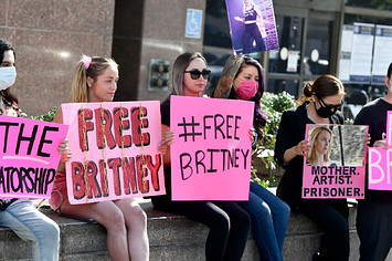 Supporters hold signs at the hearing for the Britney Spears Conservatorship.