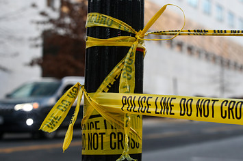 A yellow tape is pictured in a blocked street near the US Capitol Building.