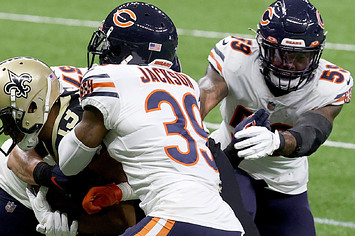 Bears players tackle Michael Thomas of the New Orleans Saints.