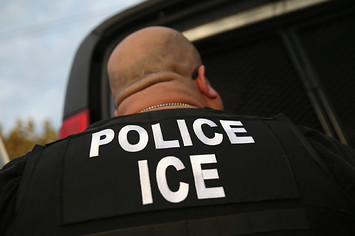 U.S. Immigration and Customs Enforcement (ICE), agents detain an immigrant.