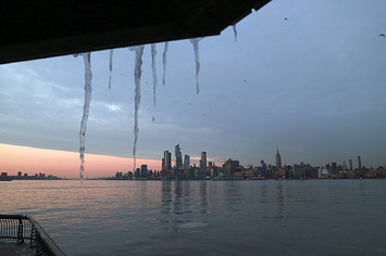 Icicles hang in front of Hudson Yards and the Empire State Building