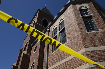 Caution tape in front of the Sacred Heart Church