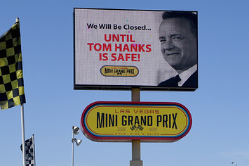 A digital billboard displays a humorous message about actor Tom Hanks