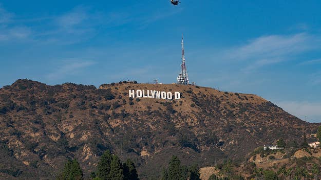 Six people were arrested on Monday after changing the Hollywood sign to read “Hollyboob.” The stunt was reportedly done to raise breast cancer awareness.