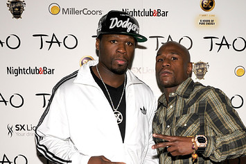 50 Cent (L) and boxer Floyd Mayweather Jr.