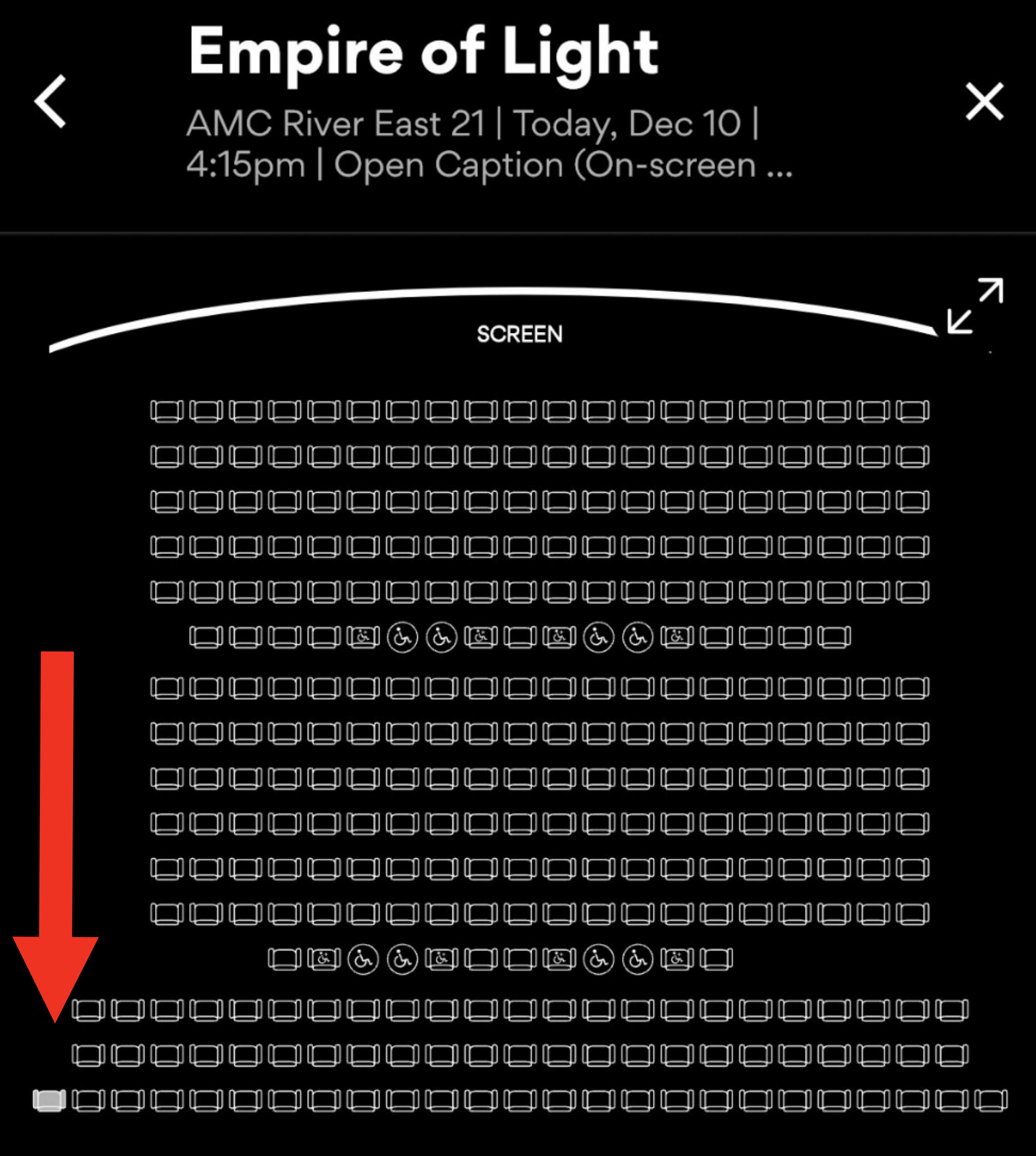 Arrow pointing to one filled seat in a theater seating diagram