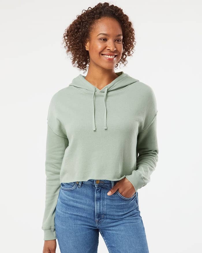 model wearing the cropped hoodie in mint green