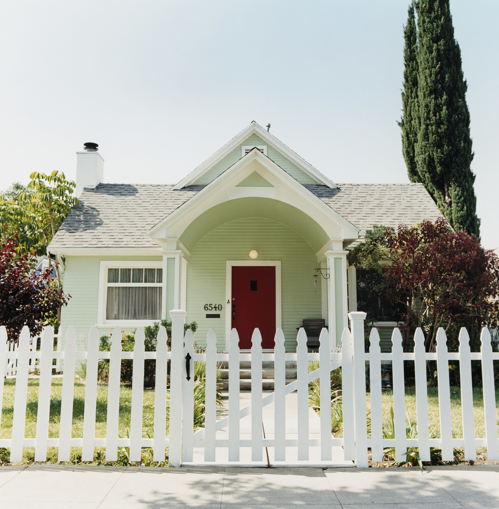 A house with a white picket fence.