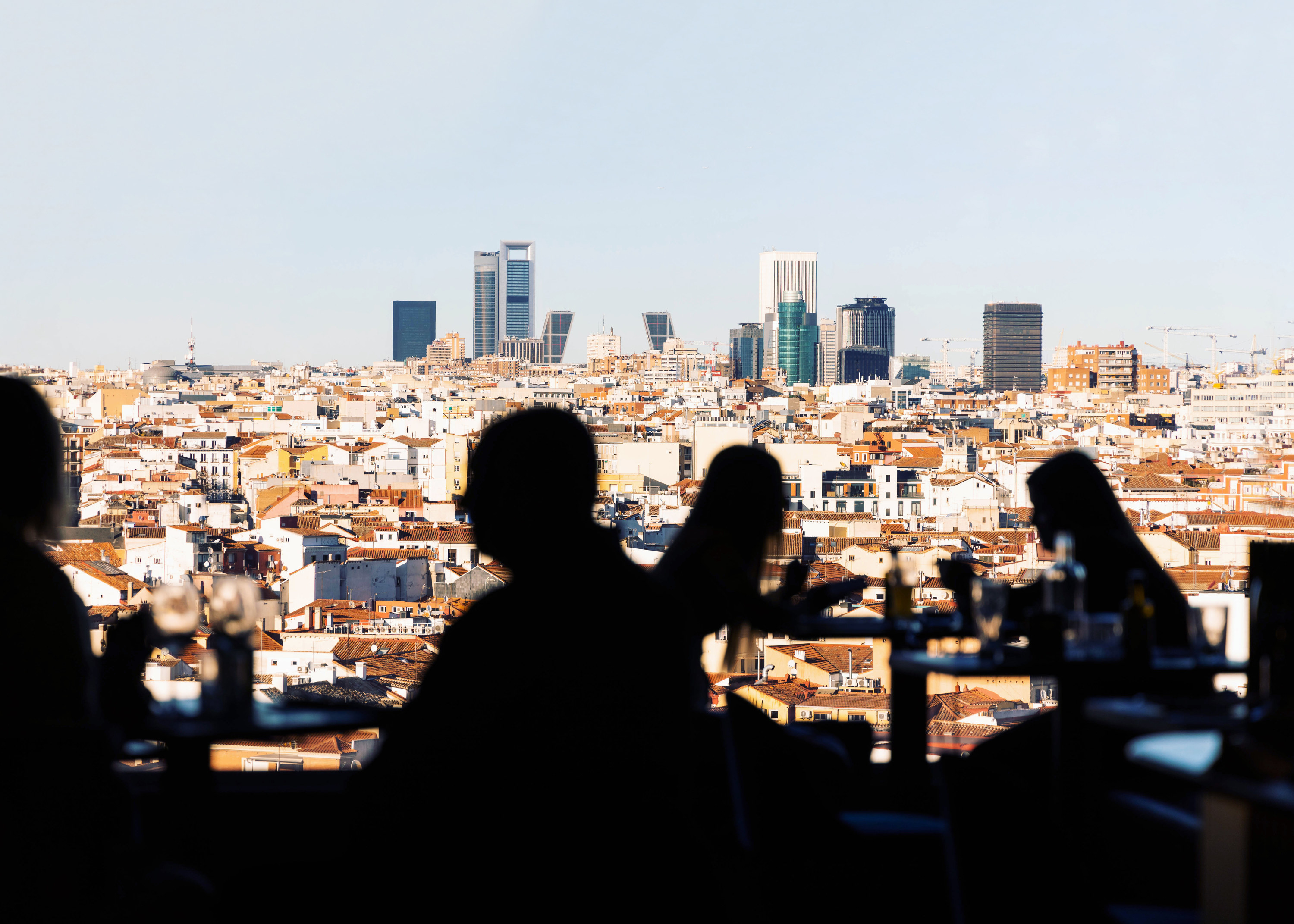 Social gathering in Madrid center with the views of the business district of Madrid, Spain