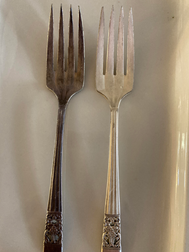 Side-by-side of a dirty and clean fork