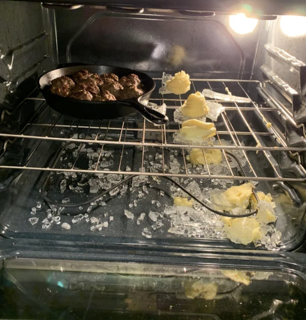 A shattered cooking dish in an oven