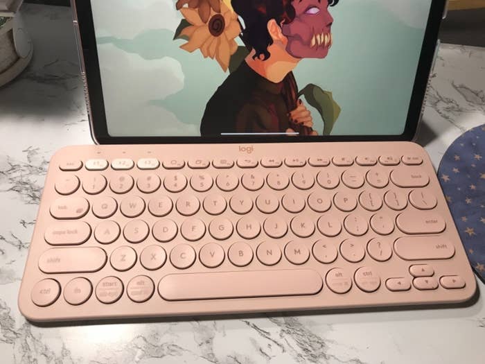 a reviewer&#x27;s keyboard in pink