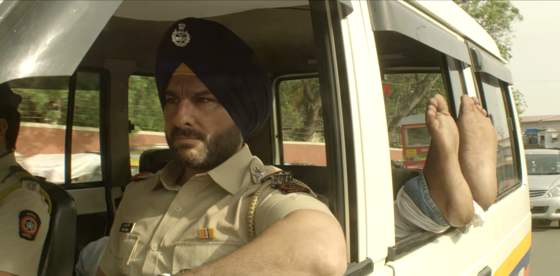 Saif Ali Khan sitting in a police car