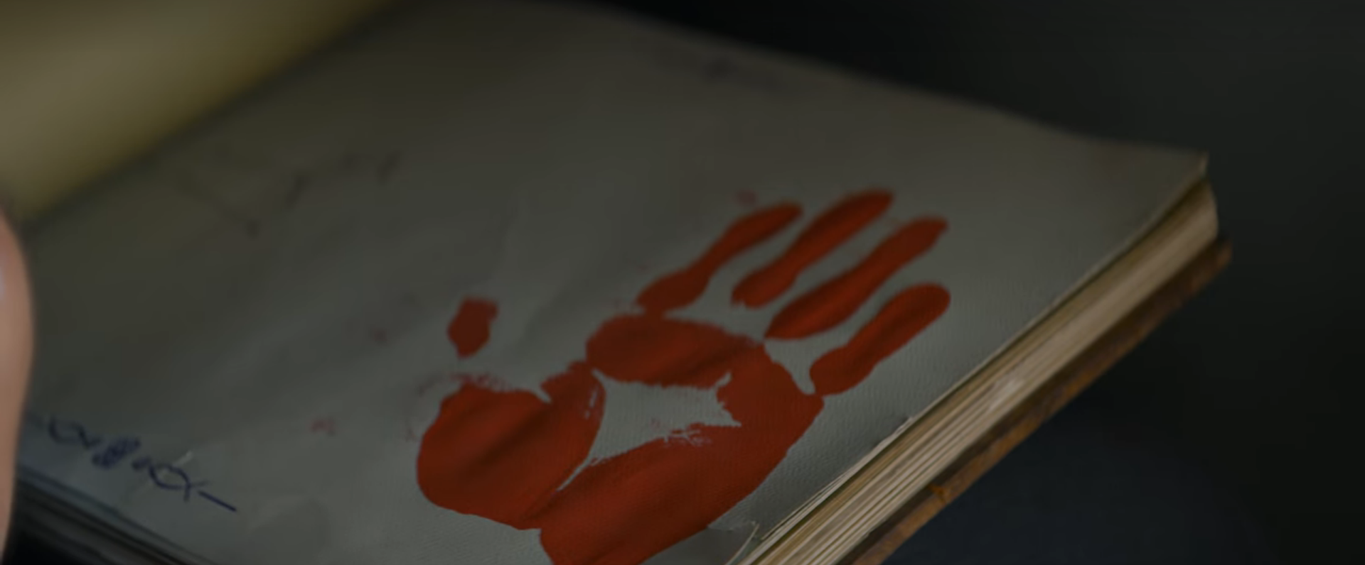 A notebook with handprints