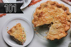 Crispy crusted chicken pot pie on a marble table top with holiday decor