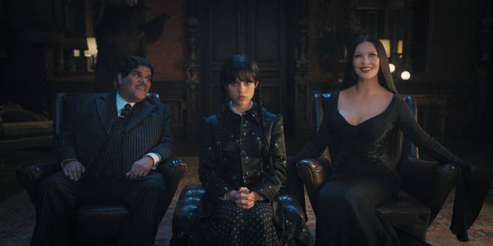 Gomez, Wednesday and morticia sitting down in a room