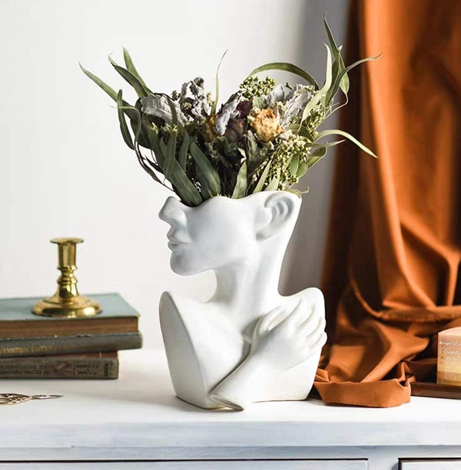 The bust with flowers inside of it