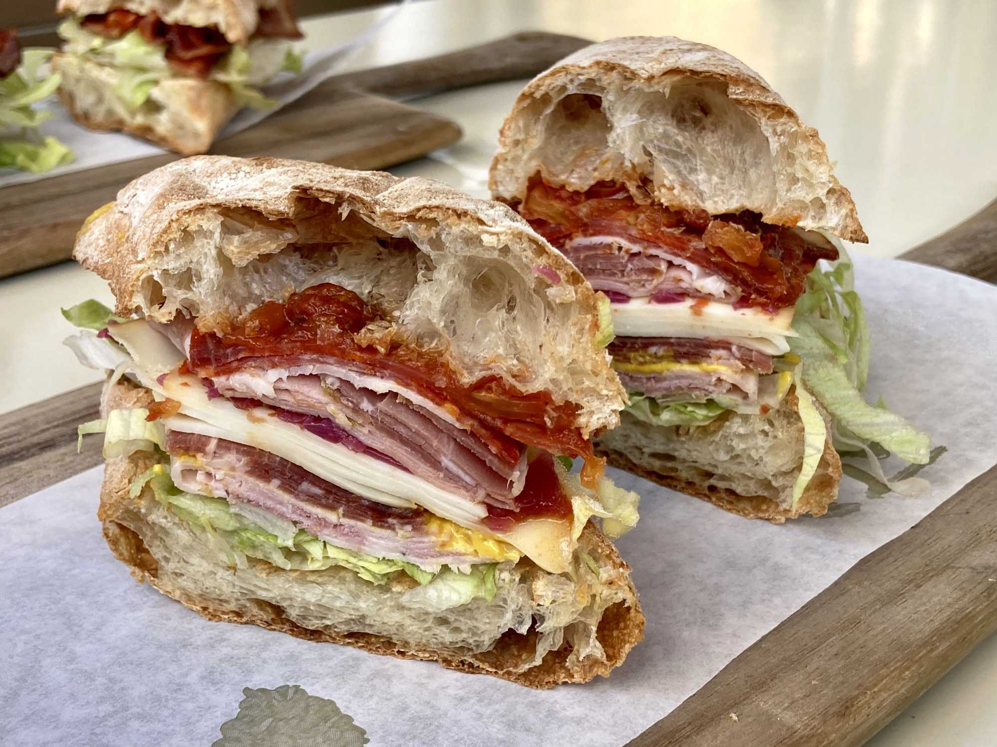 A halved Italian combo sandwich
