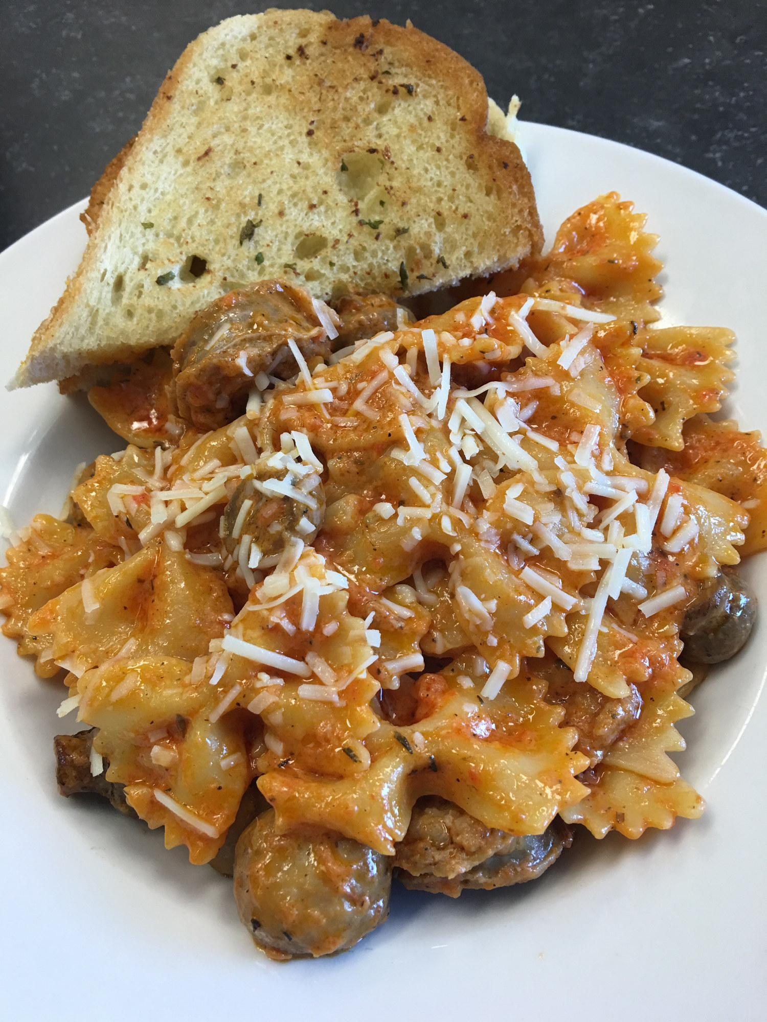 Farfalle pasta in sauce with sausage
