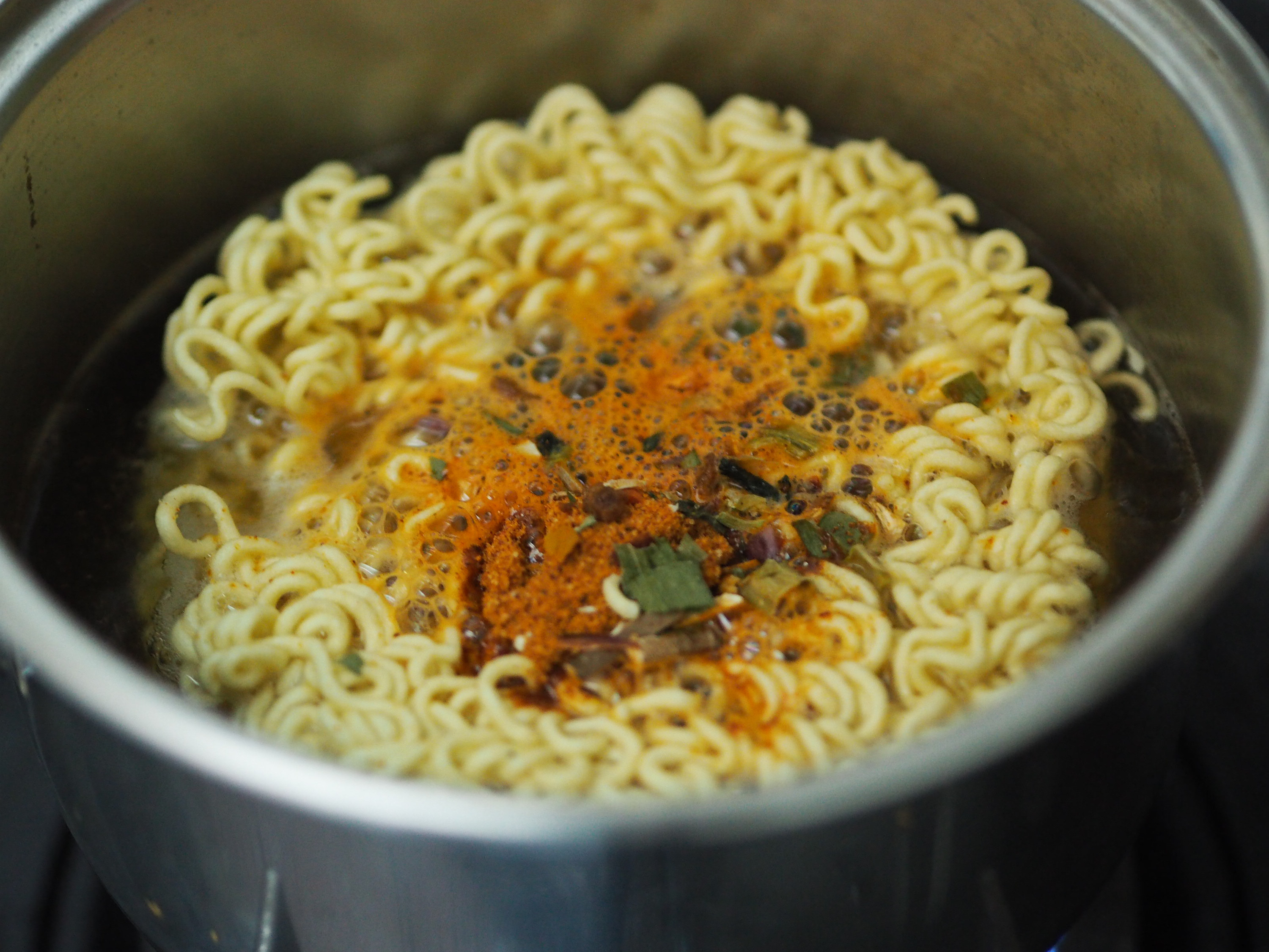 Instant noodles cooking in a pot