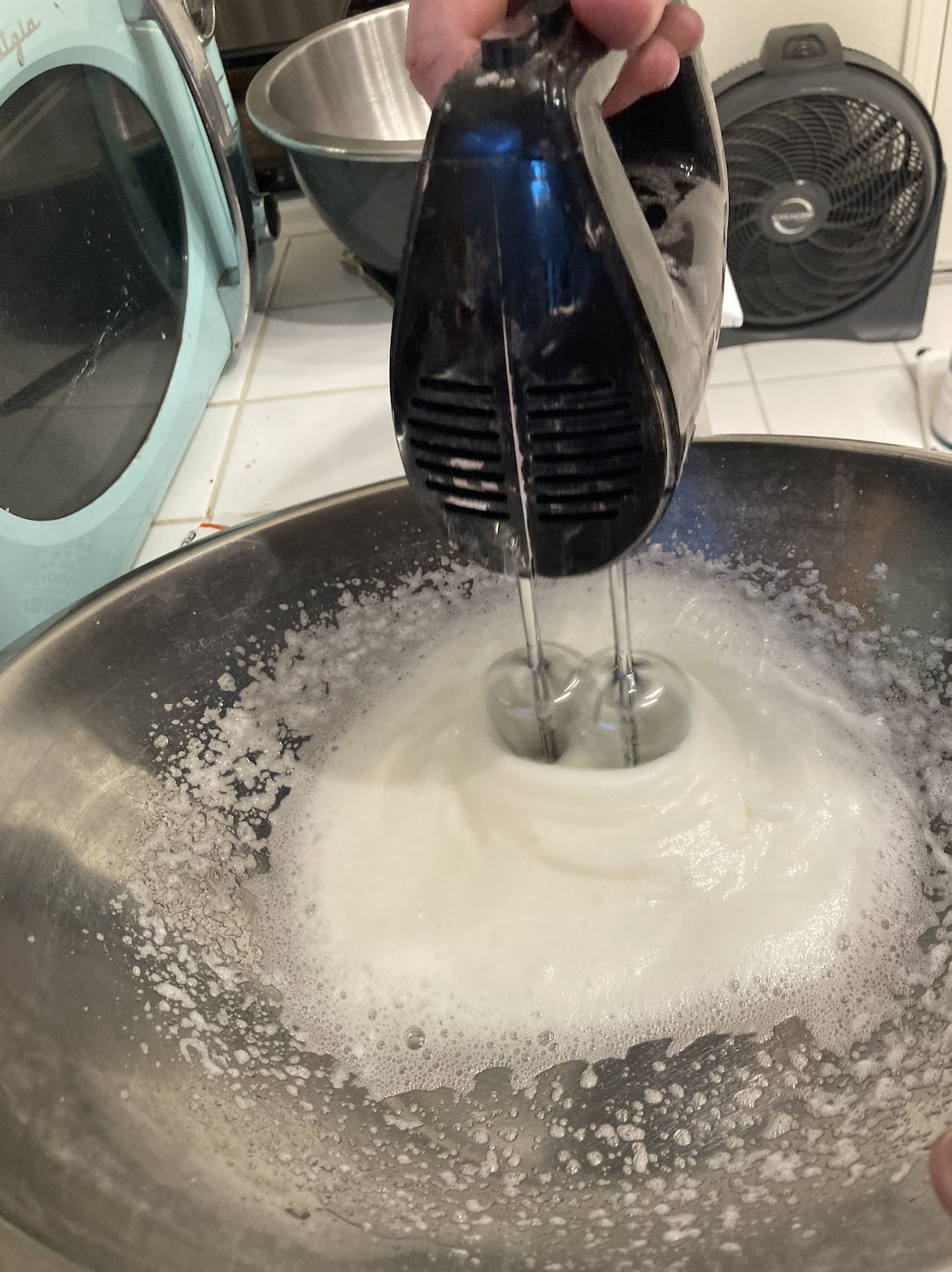 hand mixer making meringue