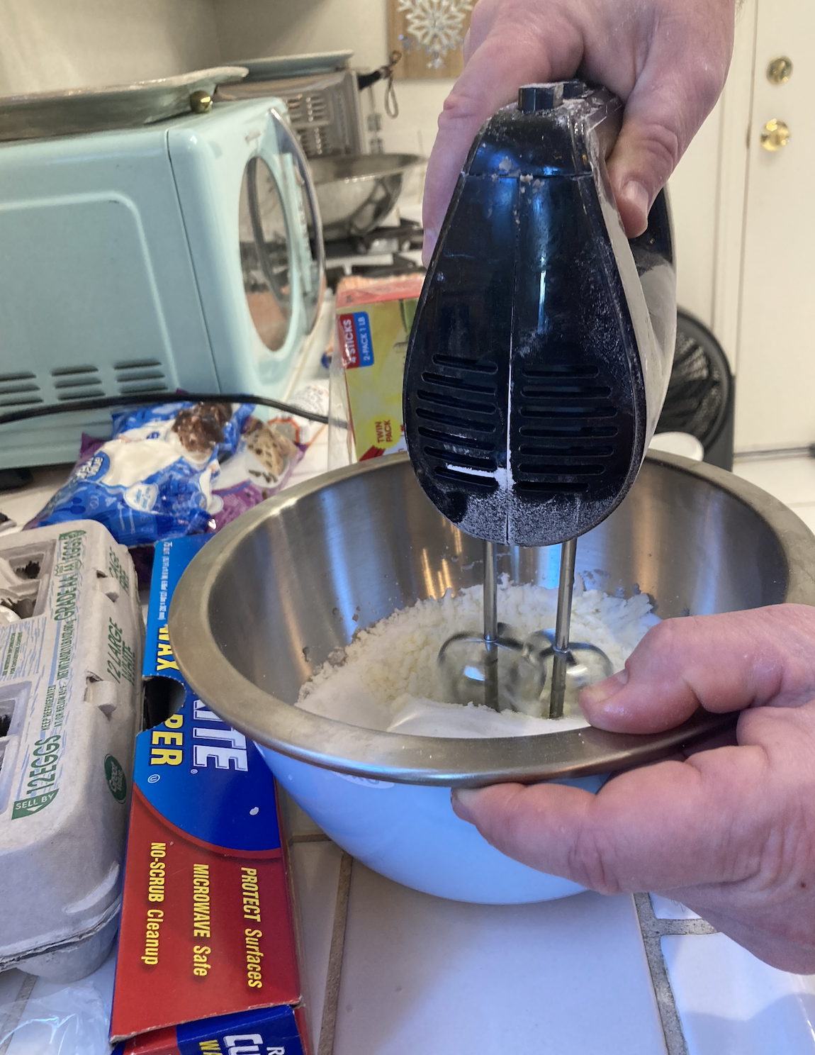 hand mixer being used in a small bowl